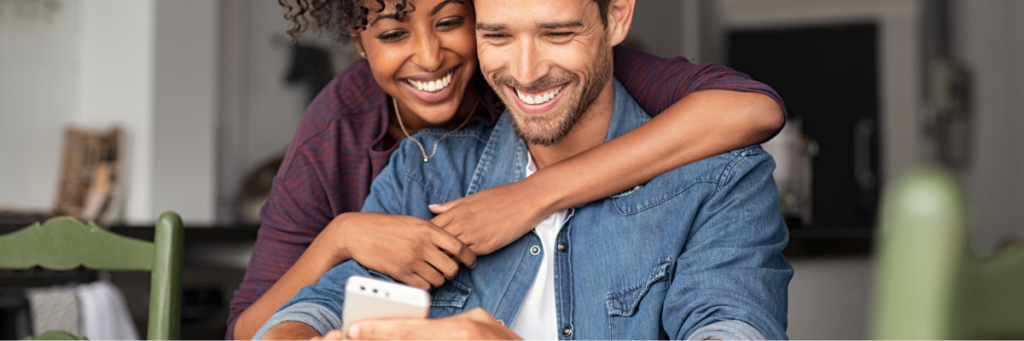 partners excited interacting with mobile phone experience
